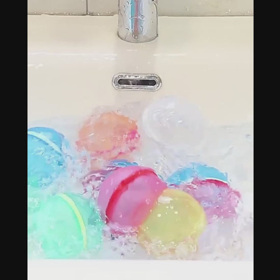colorful silicone magnetic water balloons being filled with water and squeezed.
